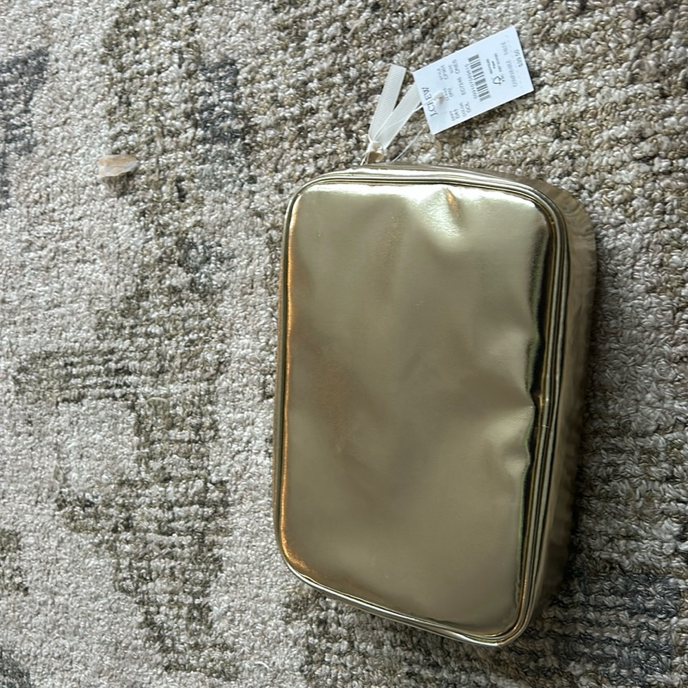 Brand new gold cosmetic bag